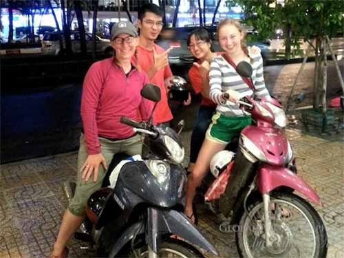 Evie, Huong, Duy, and me on our motorbikes